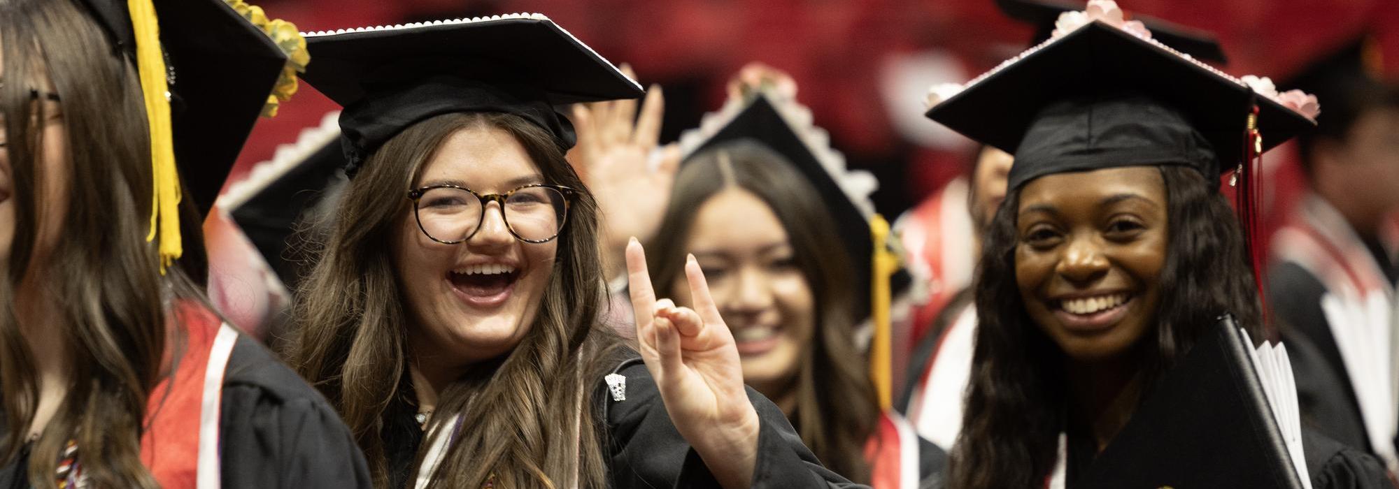 Graduate walks down aisle for processional.